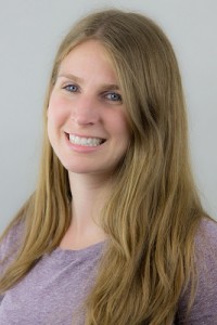 Shelby smiles. Shelby has long blond hair and wears a lavender colored sweater.