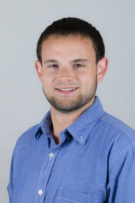 Eric Wiesman smiles and wears a light blue button up.
