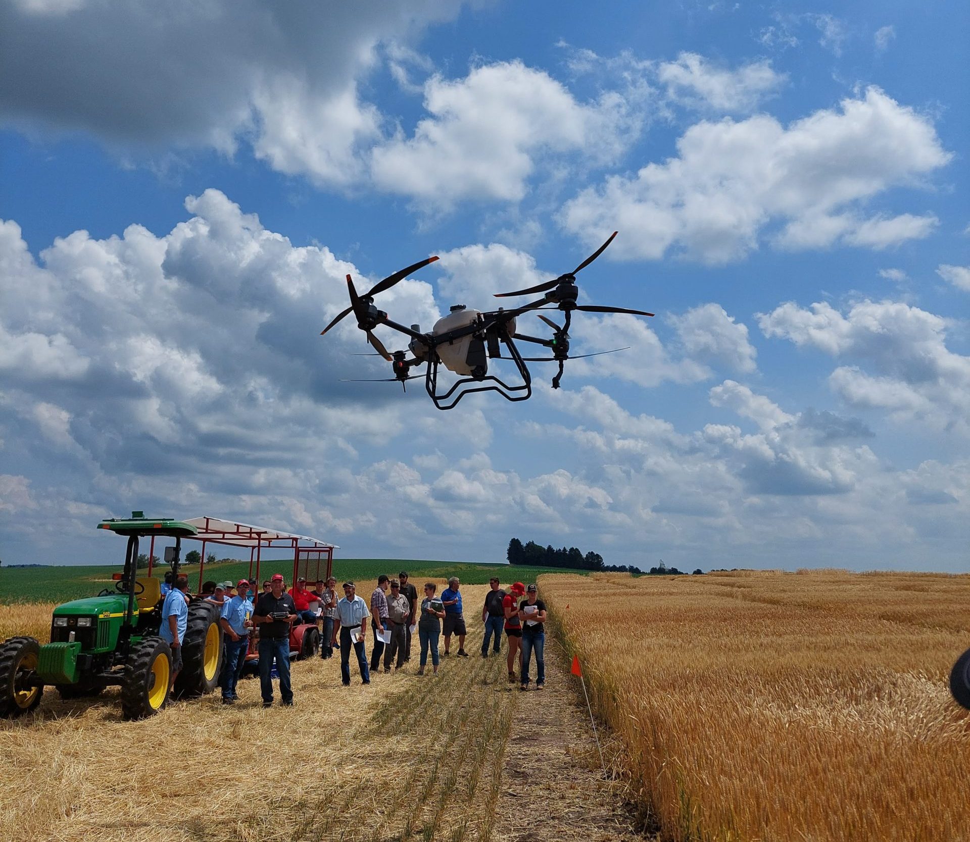 An agricultural drone flies in a field.