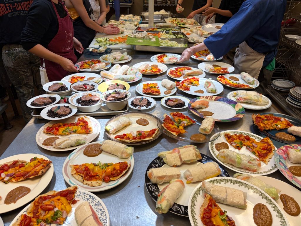 A table full of many different dishes of food.